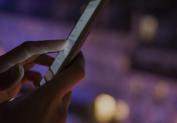 woman touching an ipad with her finger